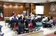 Attendees sign an agreement between the GEAP and the Juveniles "Mexico Stand Up and Shine" and "I Believe".