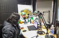 Activists of the GEAP explaining the importance of the celebration of the International Day of the Indigenous Peoples to the radio listeners and the announcers of the radio station Sopó Radio